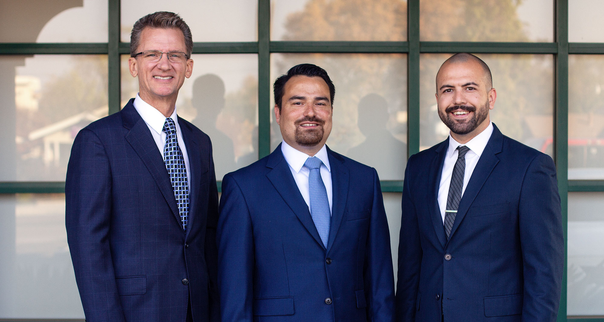 Group image taken outside of Clovis location of attorneys at Clovis Law Group